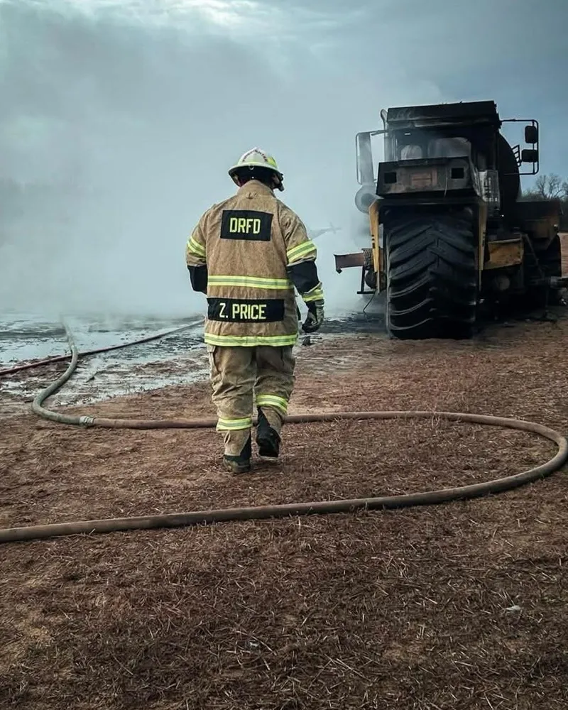 Zachary Price in his fire department turnout gear at a vehicle fire